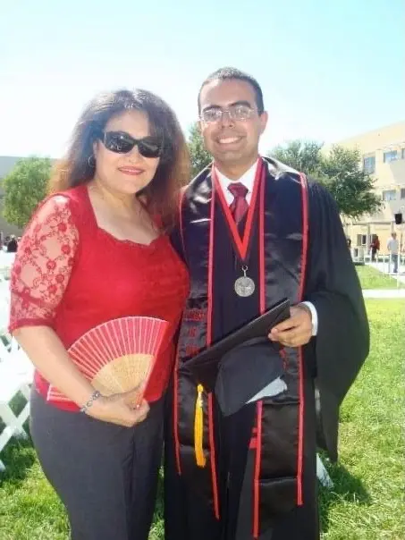 Picture: Gg, founder of Blue Ivy Spirits, and her son Andrew at his graduation ceremony